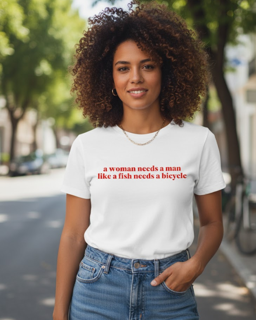 a woman needs a man like a fish needs a bicycle (camiseta)
